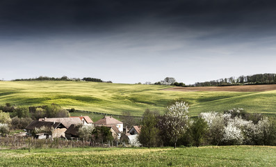 Fototapeta premium Peaceful scene in sunset about a valley with a small village Abaliget, Hungary