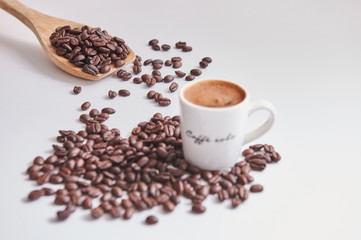 Coffee beans white glass Turkish coffee wooden spoon.