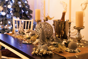 Festive table with Christmas decorations in the home interior