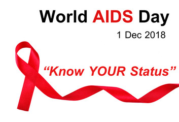 World AIDS Day concept, red ribbon on white background with text "World AIDS Day 2018, Know Your Status", an international day dedicated to raising awareness of the AIDS with this year's theme