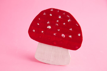 wooden props mushroom on colorful background