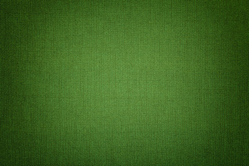 Dark green background from a textile material with wicker pattern, closeup.