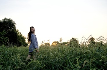 Asian female model poses for pictures in the nature