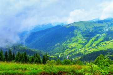 Fototapeta na wymiar hillsides beautiful mountain landscape, the village home. Ukraine Carpathians
