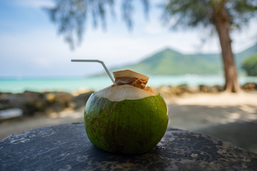 Fresh coconut on the wood table.