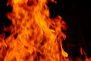 A background filled with defocused fire flames.