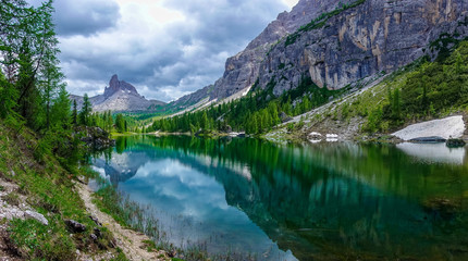 Naklejka na ściany i meble The panorama view of Federa lake with the background of Dolomites Alps, Cortina D'Ampezzo, South Tyrol, Dolomites, Italy.