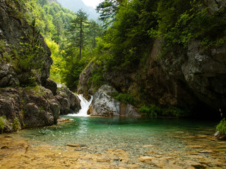 Small waterfall with perfectly clear water, Olympus National Park, Enipeas Canyon, Greece