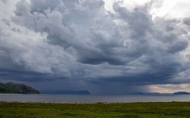stormy skies over fjord