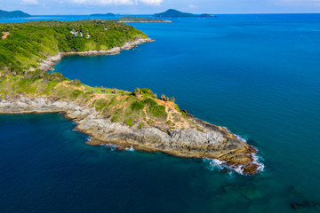 Fototapeta na wymiar Aerial view of a rocky peninsula leading into a tropical oceal (Promthep Cape, Phuket)