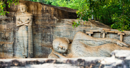 (selective focus) The beautiful statue of Reclining Buddha and Monk Ananda, Gal Viharaya,...