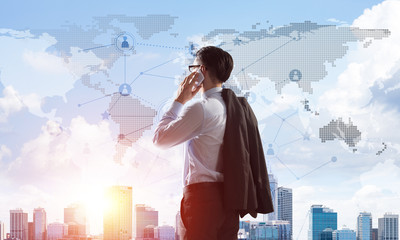 Concept of business success and control with confident boss against cityscape background