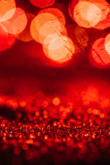 abstract christmas background with red glitter and bokeh