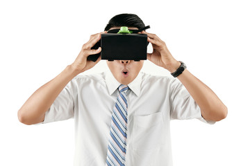 Unrecognizable male office worker wearing head-mounted display exploring virtual reality isolated on white background
