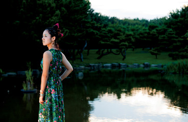 Asian female model poses for pictures in the nature