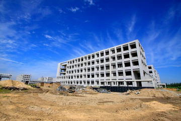 Unfinished construction site under the blue sky, China