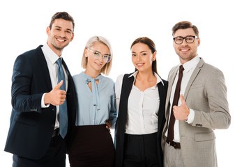 successful businessmen showing thumbs up and standing with female coworkers isolated on white
