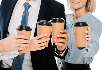 cropped view of businesspeople holding cups with coffee to go isolated on white