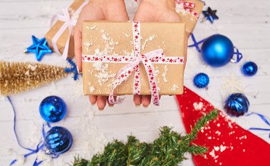 christmas cookies and glass of milk on wooden table