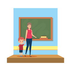 female teacher with boy in the classroom