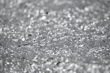 Crumpled aluminum silver foil background. Blurred abstract background