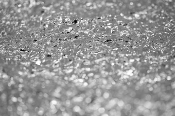 Crumpled aluminum silver foil background. Blurred abstract background