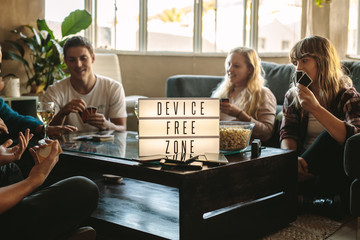Digital detox - Friends playing cards at device free zone