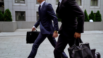 Entrepreneurs running to important meeting with partners, stressful job, traffic