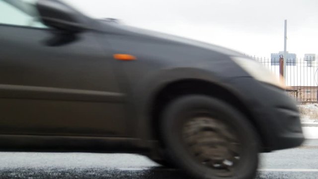 Winter Driving. Car Trouble. A troubled young man rummaging in the trunk