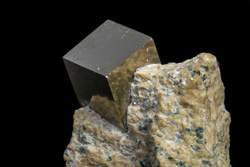 Macro Pyrite mineral stone on black background