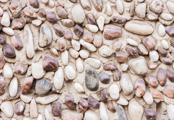 Wall decorated with sea stones in park in Catania, Sicily, Italy