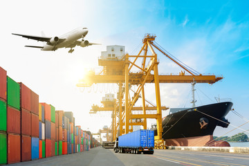 Ship cargo containers loading to harbor by crane , with export and import and logistics.