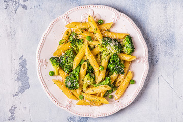 Pasta with broccoli, green peas, garlic, cheese.