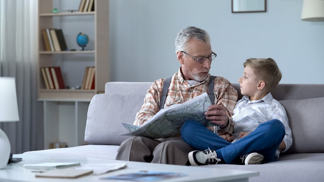 Old Man Veteran Viewing Map With Grandson Showing Front Line, Remembering War