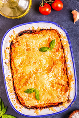 Traditional italian lasagna with vegetables, minced meat and cheese.