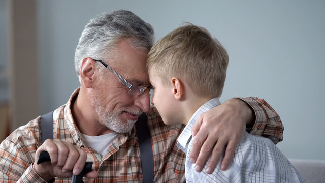 Grandpa And Grandson Leaning Foreheads Together, Family Love, Sentimentality