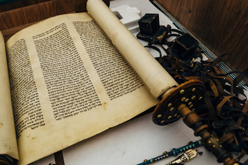 Hebrew religious handwritten Torah parchment scroll, selective focus