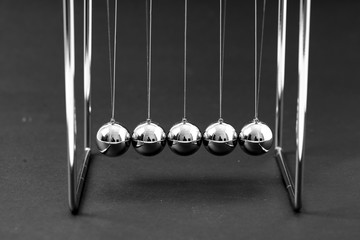 Newtons Cradle balancing balls, business concept in studio