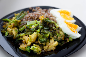 Buckwheat porridge with boiled eggs, vegetables and broccoli