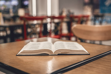 Book is on the table in the library