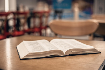 Book is on the table in the library