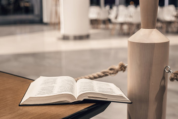 Book is on the table in the library