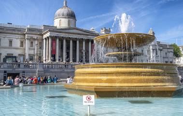 LONDON - MAY 2015: Tourists in front of National Gallery on a beautiful day. London is visited by...