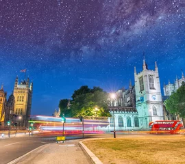 Foto auf Leinwand Traffic along Westminster area at night with stars. Two red buses, one speeding up fast © jovannig