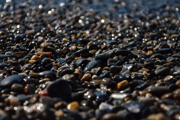 pebble beach on the black sea. the wave in the background.