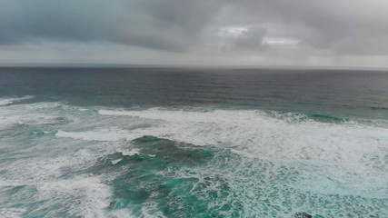 Beautiful aerial view of ocean with waves during a storm. Drone high point of view
