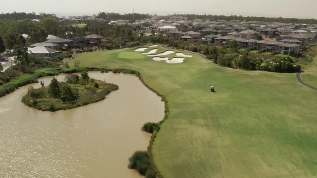 A golf cart driving along a Golf Range