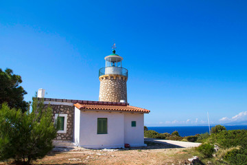 Fototapeta na wymiar Skinari Lighthouse in summer season. Zakynthos island, Greece
