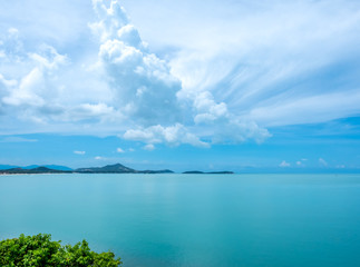 Seascape view under cloudy blue sky