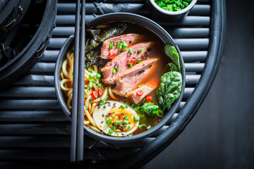 Top view of Ramen soup with noodles and spinach